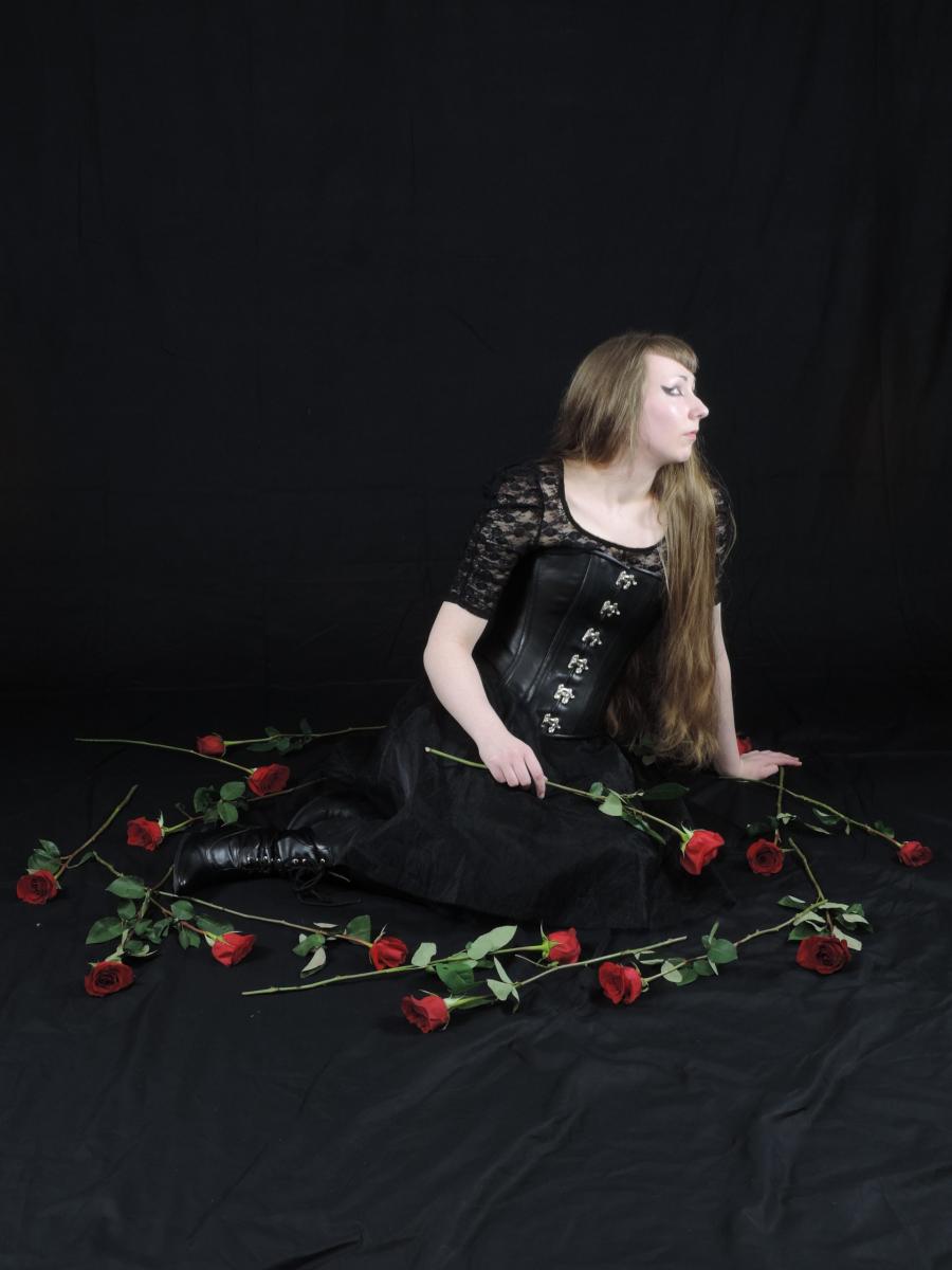 Kat sitting with roses