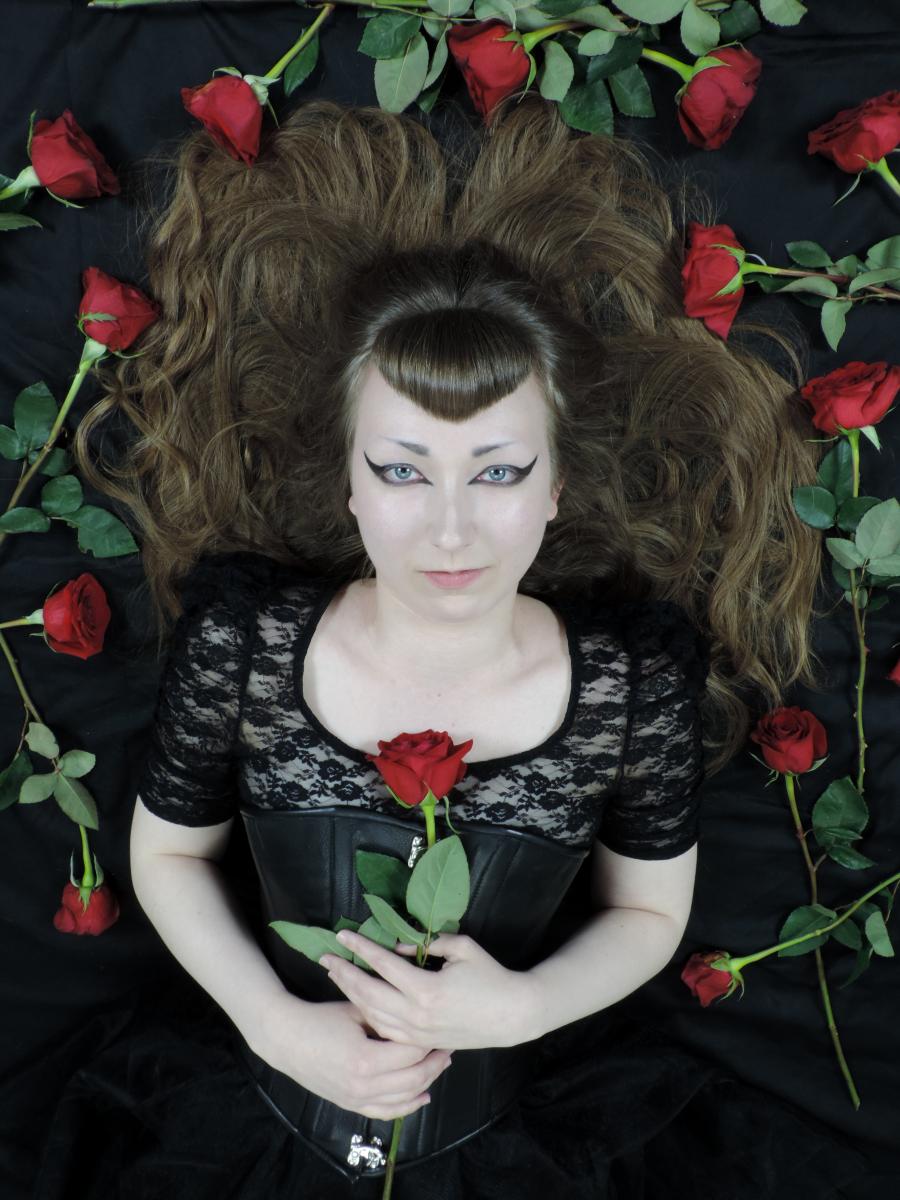 Kat lying with roses